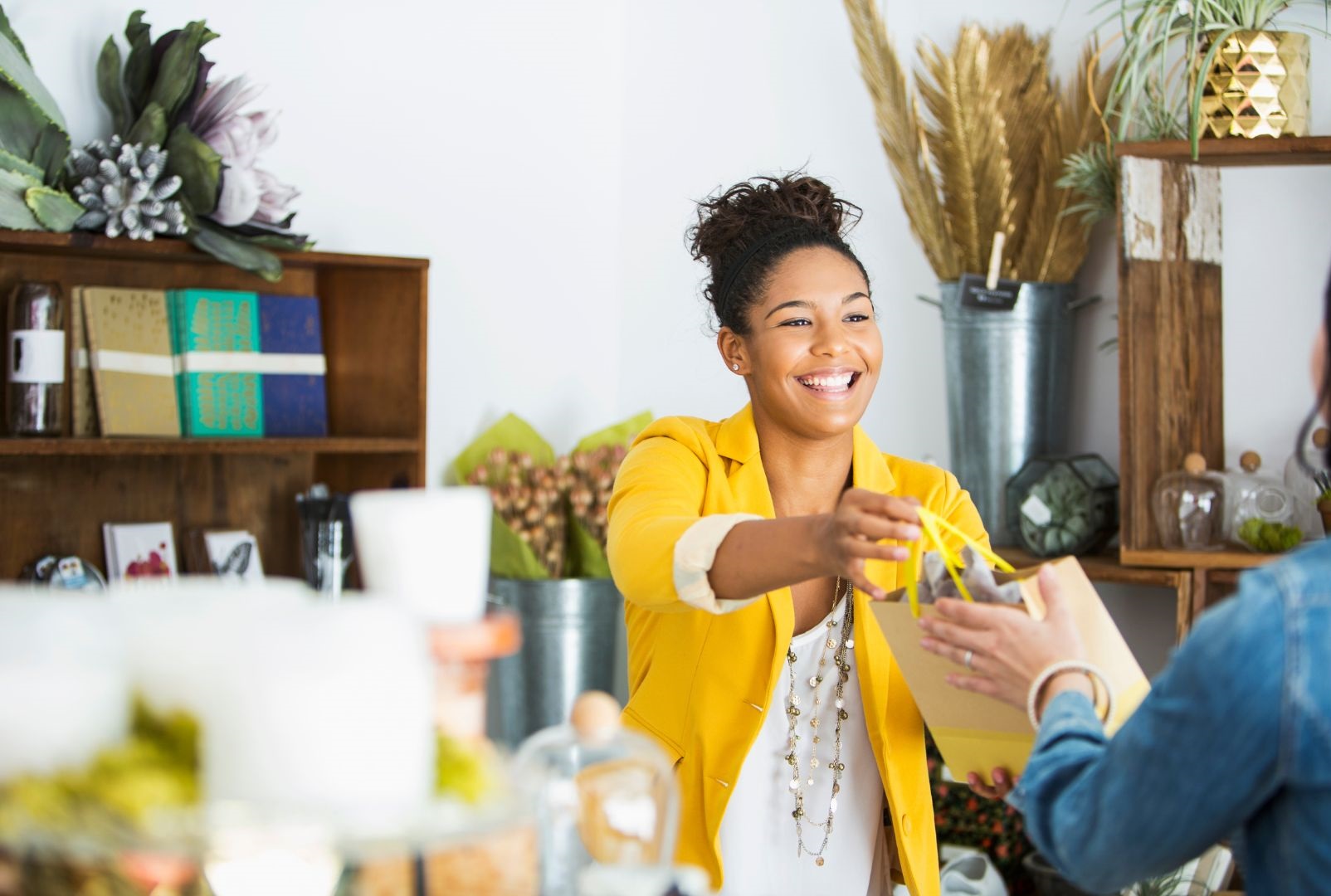 Woman checking out at a gift shop, building customer loyalty