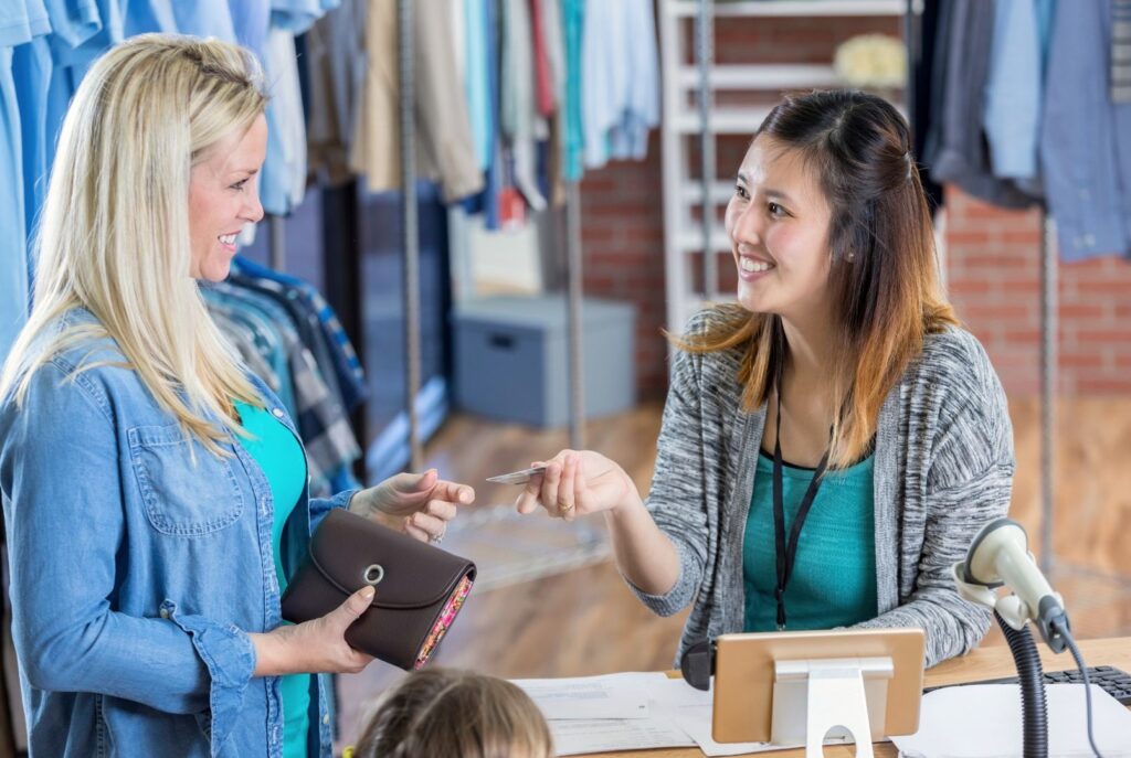 Women checking out at a clothing store