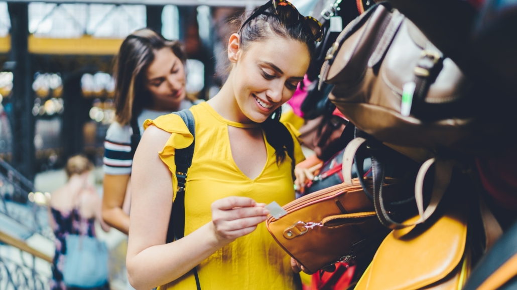 Woman Checking Tag In Store